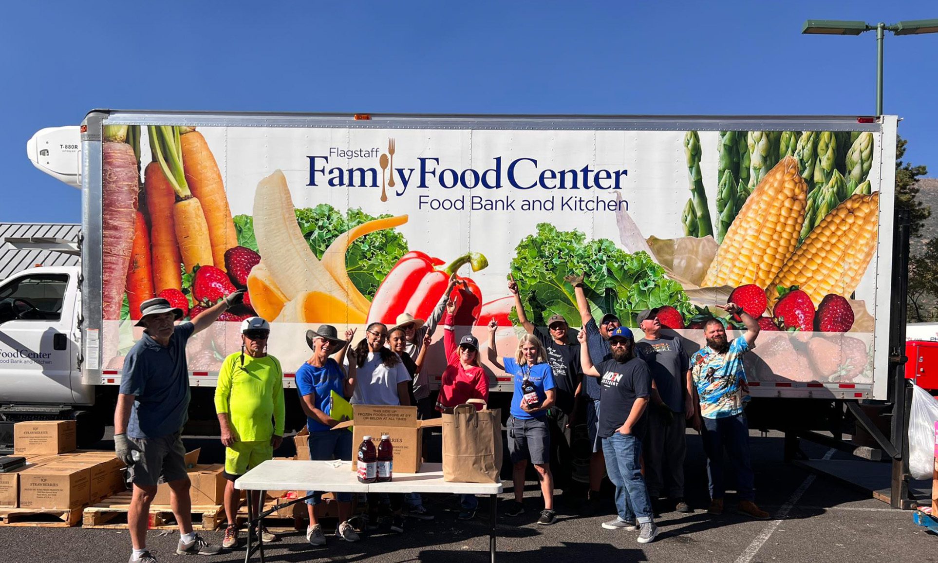 volunteers posing in front of FFFC box truck